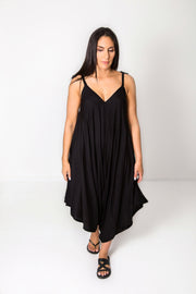 Photo of model wearing NOOZ Bali Jumpsuit, unbelted, in black.