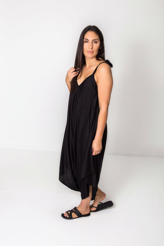 Photo of model wearing NOOZ Bali Jumpsuit, unbelted, in black.